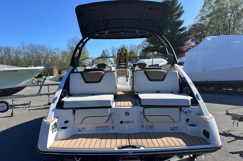 Slide: The Image of 2021 Yamaha Boats 252SD, rear view, showcasing spacious seating and sleek design. - 8
