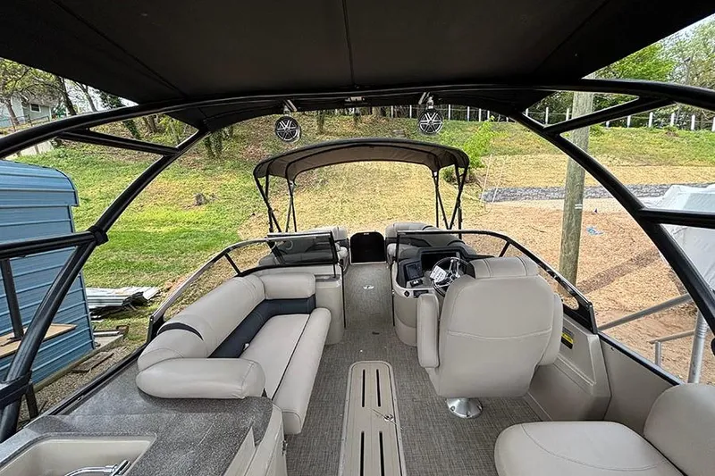 Slide: The Image of Interior of 2017 Avalon Ambassador Elite Windshield boat, featuring spacious seating and modern design. - 16