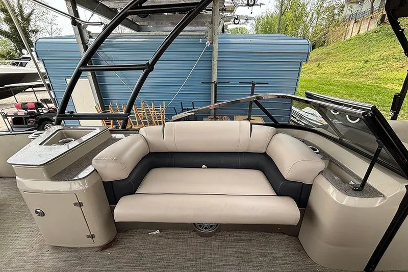 Slide: The Image of 2017 Avalon Ambassador Elite Windshield boat interior with beige seating and sleek design. - 17