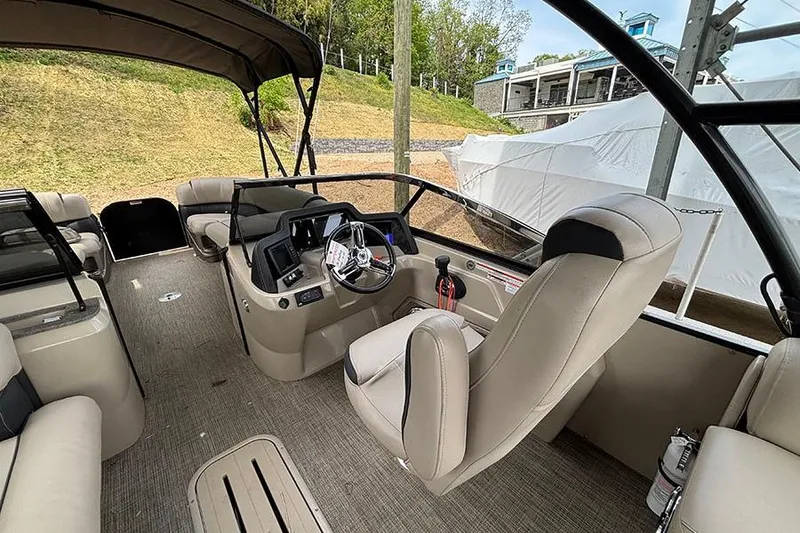 Slide: The Image of Interior of 2017 Avalon Ambassador Elite Windshield boat, featuring luxurious seating and modern controls. - 19