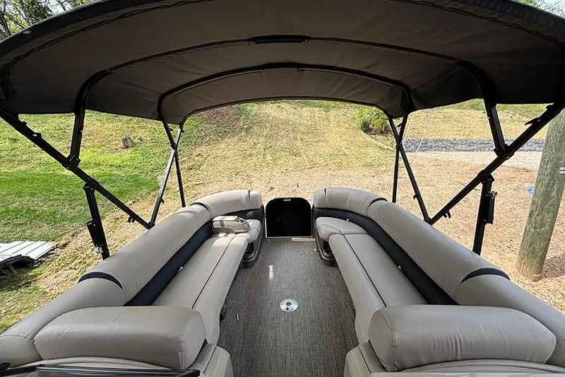 Slide: The Image of 2017 Avalon Ambassador Elite Windshield boat interior with spacious seating and canopy. - 21