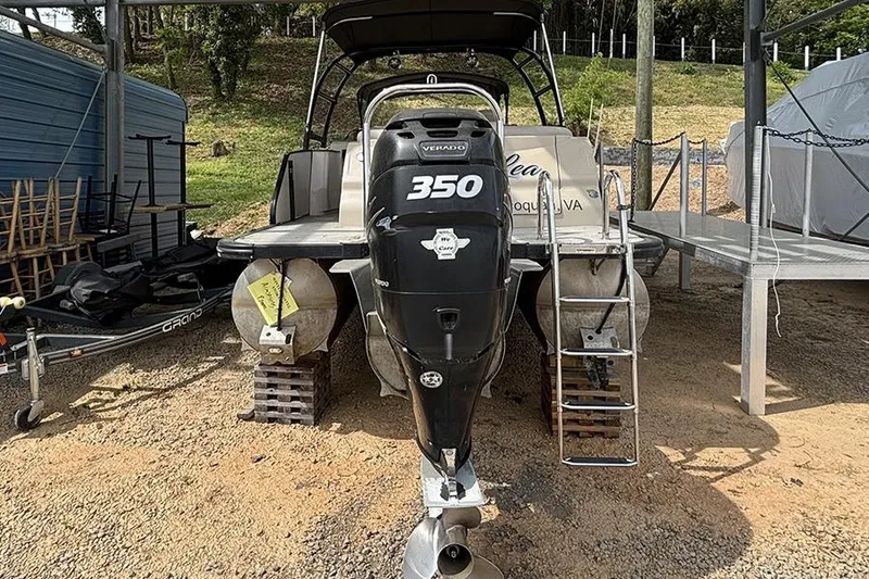 Slide: The Image of 2017 Avalon Ambassador Elite Windshield boat with Verado 350 engine, docked outdoors. - 3