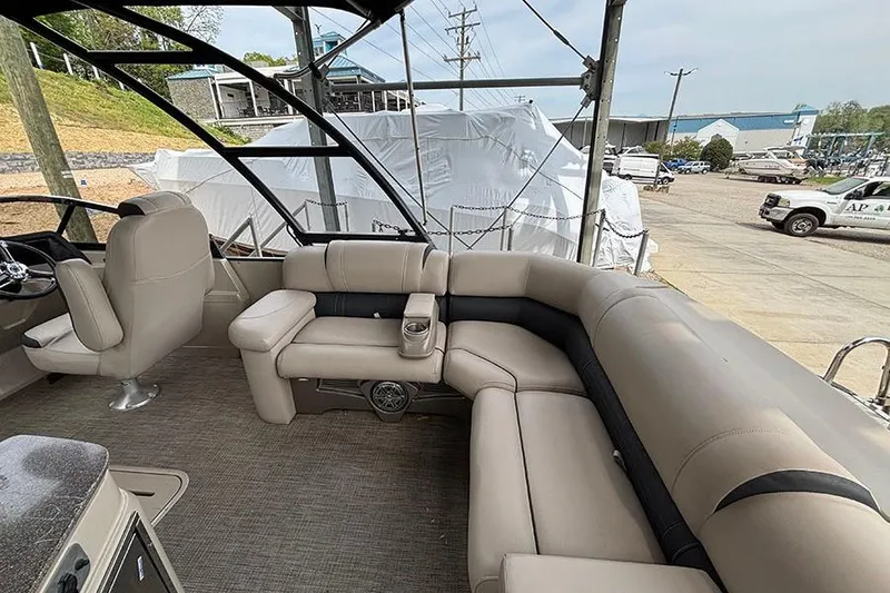 Slide: The Image of Luxurious interior of 2017 Avalon Ambassador Elite Windshield boat with plush seating. - 9
