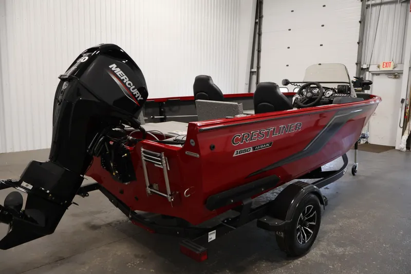 Slide: The Image of 2026 Crestliner 1650 HAWK SC boat with Mercury engine in a showroom. - 9