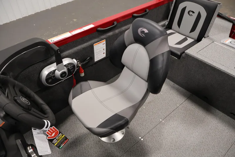 Slide: The Image of 2026 Crestliner 1650 HAWK SC boat interior with steering wheel and seating. - 27