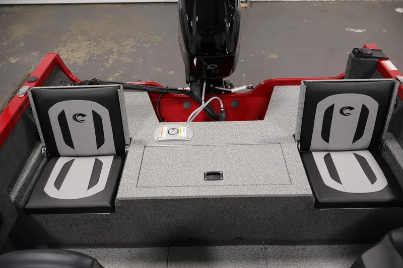 Slide: The Image of 2026 Crestliner 1650 HAWK SC boat interior with dual seats and motor. - 30