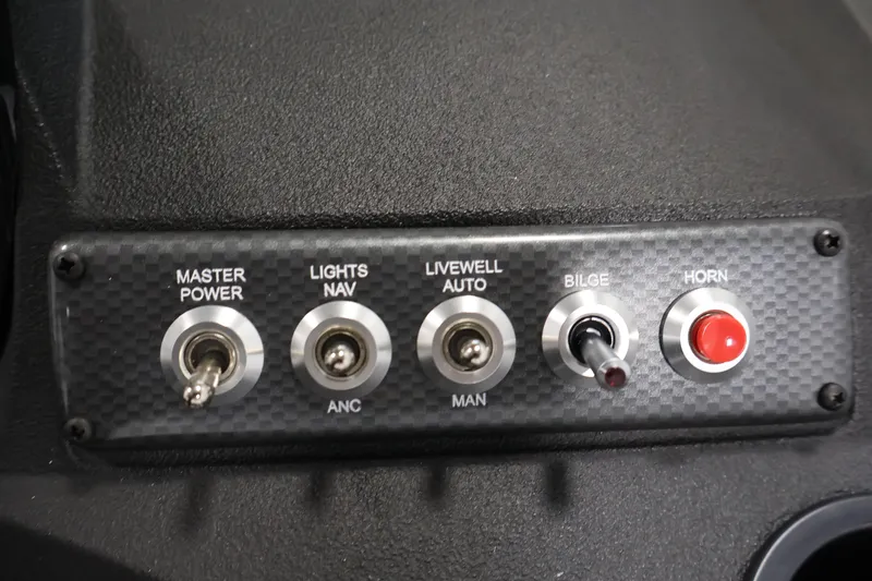 Slide: The Image of Control panel of 2026 Crestliner 1650 HAWK SC boat with switches and buttons. - 26