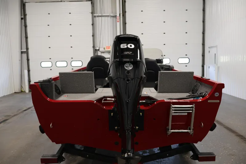 Slide: The Image of 2026 Crestliner 1650 HAWK SC boat with 50 HP Mercury engine in a garage setting. - 10