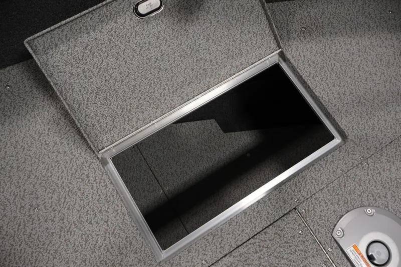 Slide: The Image of 2026 Crestliner 1650 Hawk SC boat storage compartment with open hatch. - 26