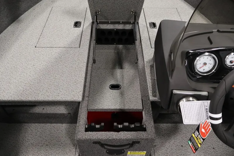 Slide: The Image of Interior of 2026 Crestliner 1650 Hawk SC boat showing storage and control panel. - 16