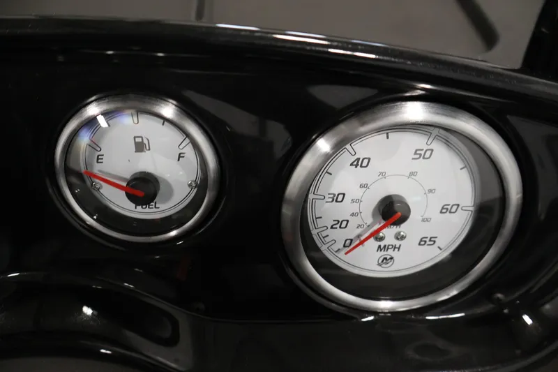 Slide: The Image of Dashboard gauges of 2026 Crestliner 1650 HAWK SC, showing fuel and speed indicators. - 24