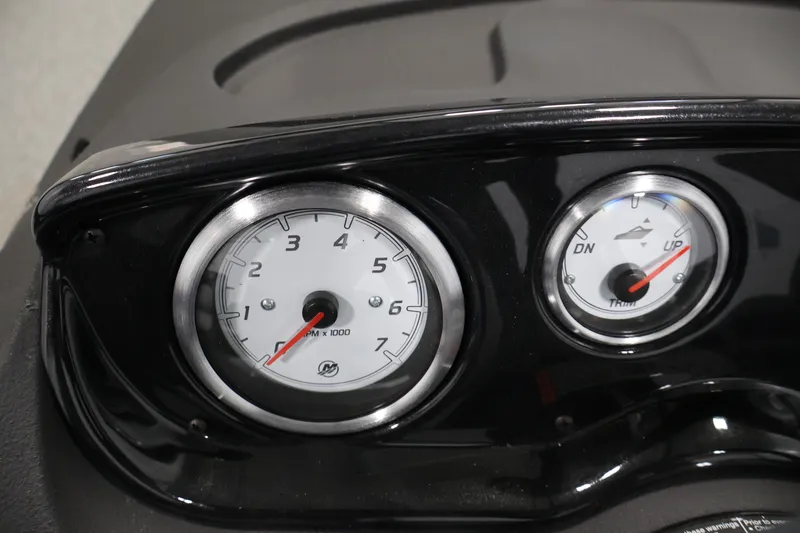 Slide: The Image of Dashboard gauges of 2026 Crestliner 1650 HAWK SC boat, showing RPM and trim indicators. - 23