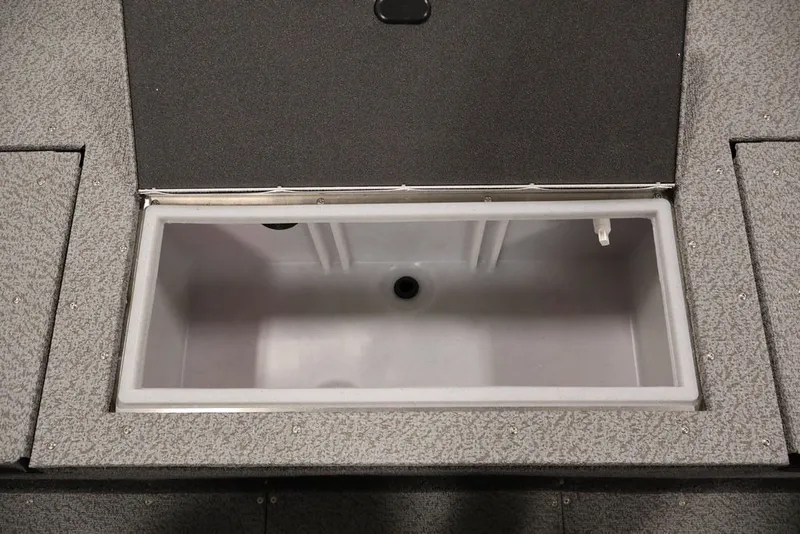 Slide: The Image of 2026 Crestliner 1650 Hawk SC boat storage compartment, open and empty. - 30