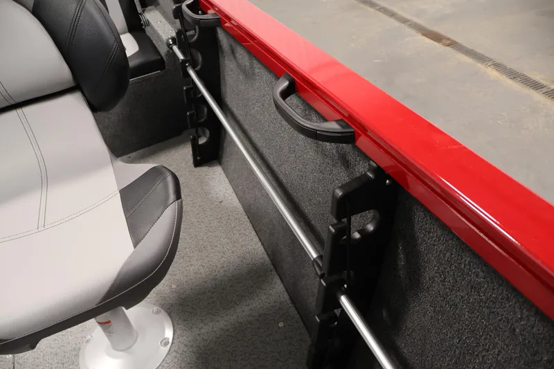 Slide: The Image of 2026 Crestliner 1650 HAWK SC interior with gray seating and red trim detail. - 29