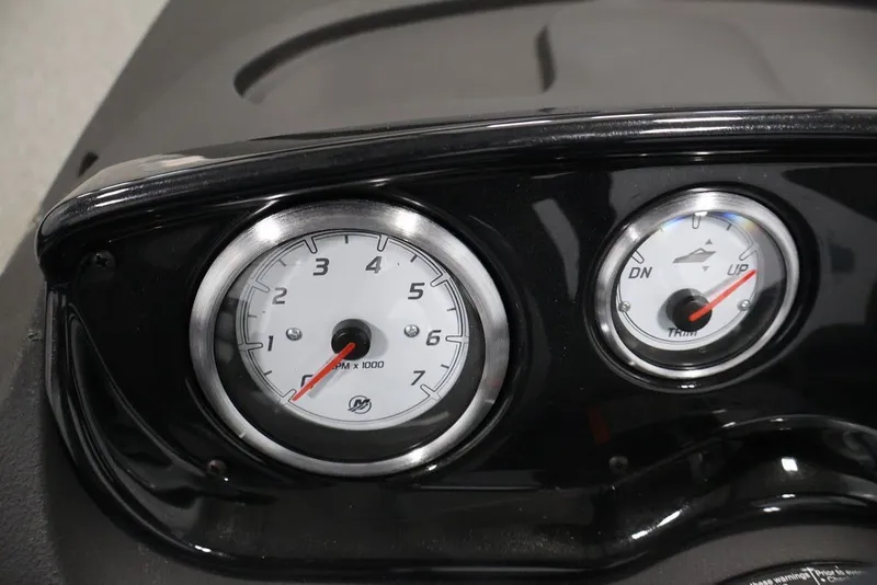 Slide: The Image of Dashboard gauges of 2026 Crestliner 1650 Hawk SC boat, showing RPM and trim indicators. - 19