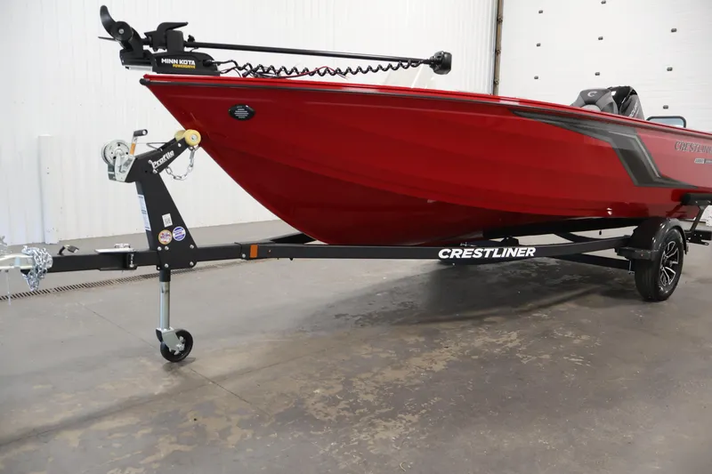 Slide: The Image of 2026 Crestliner 1650 HAWK SC boat in vibrant red on trailer, featuring Minn Kota motor. - 37