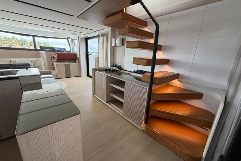 Slide: The Image of Luxurious interior of 2028 Solaris Power 70 Long Range yacht with modern staircase design. - 11