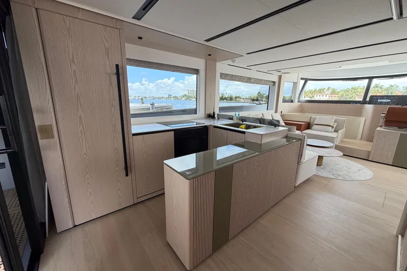 Slide: The Image of Luxurious interior of 2028 Solaris Power 70 Long Range yacht with modern kitchen and seating area. - 12