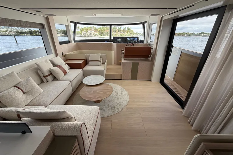 Slide: The Image of Luxurious interior of 2028 Solaris Power 70 Long Range yacht with elegant seating and panoramic views. - 13