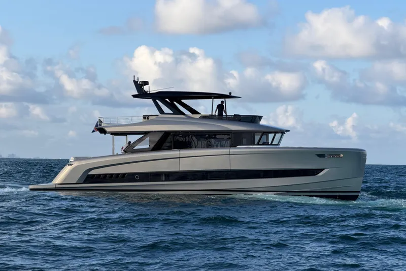 Slide: The Image of 2028 Solaris Power 70 Long Range yacht cruising on open sea under blue sky. - 2