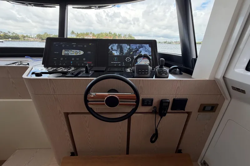 Slide: The Image of Cockpit of 2028 Solaris Power 70 Long Range yacht with advanced navigation systems. - 20