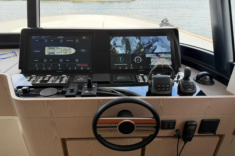 Slide: The Image of Control panel of 2028 Solaris Power 70 Long Range yacht with advanced navigation displays. - 21