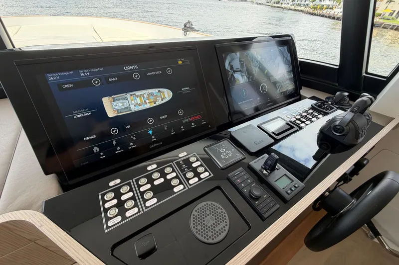 Slide: The Image of Control panel of 2028 Solaris Power 70 Long Range yacht with advanced navigation displays. - 23