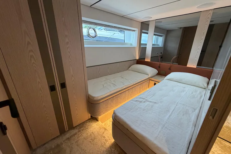 Slide: The Image of Luxurious cabin interior of 2028 Solaris Power 70 Long Range yacht with twin beds. - 29