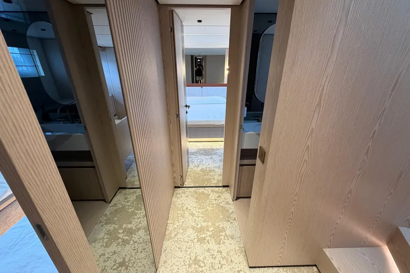 Slide: The Image of Luxurious interior of 2028 Solaris Power 70 Long Range yacht, featuring modern wood paneling. - 30