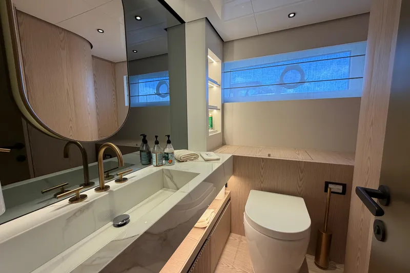 Slide: The Image of Luxurious bathroom interior of 2028 Solaris Power 70 Long Range yacht, featuring modern fixtures and elegant design. - 31