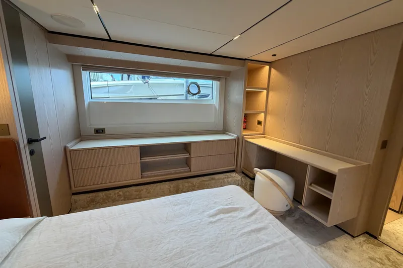 Slide: The Image of Luxurious interior of 2028 Solaris Power 70 Long Range yacht, featuring modern wood furnishings. - 34