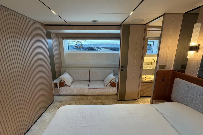 Slide: The Image of Luxurious interior of 2028 Solaris Power 70 Long Range yacht, featuring elegant wood paneling and cozy seating. - 35
