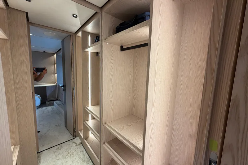 Slide: The Image of Luxurious interior of 2028 Solaris Power 70 Long Range yacht with wooden cabinetry and modern design. - 38