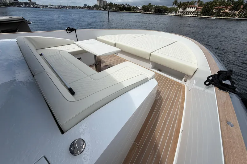 Slide: The Image of Luxurious seating area on 2028 Solaris Power 70 Long Range yacht, docked by the waterfront. - 41