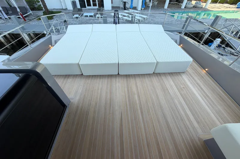 Slide: The Image of Luxurious deck of 2028 Solaris Power 70 Long Range yacht with cushioned seating. - 51