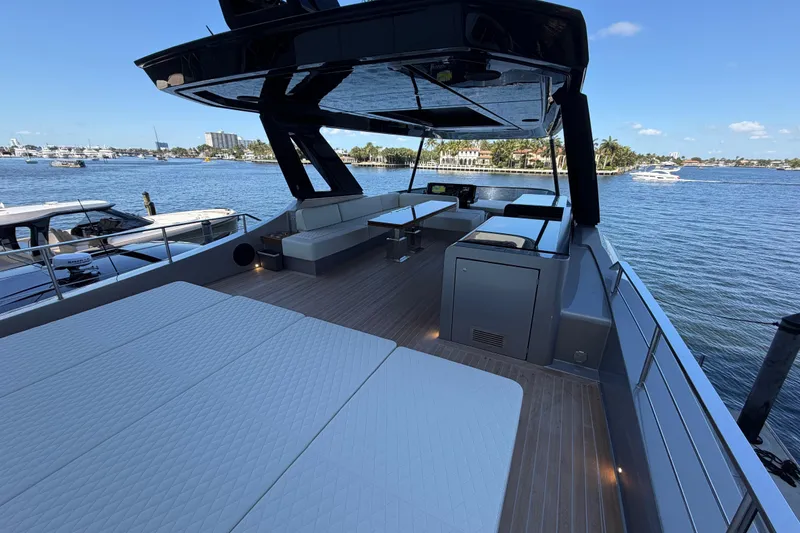 Slide: The Image of Luxurious 2028 Solaris Power 70 Long Range yacht with spacious deck and scenic waterfront view. - 53