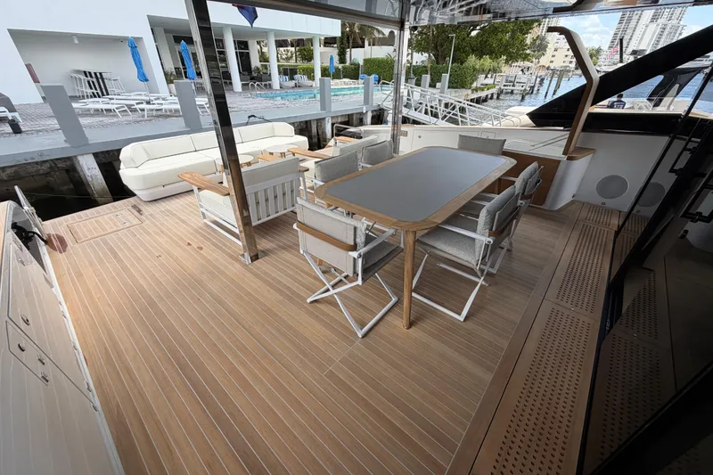 Slide: The Image of Spacious deck of 2028 Solaris Power 70 Long Range yacht with elegant seating and dining area. - 8
