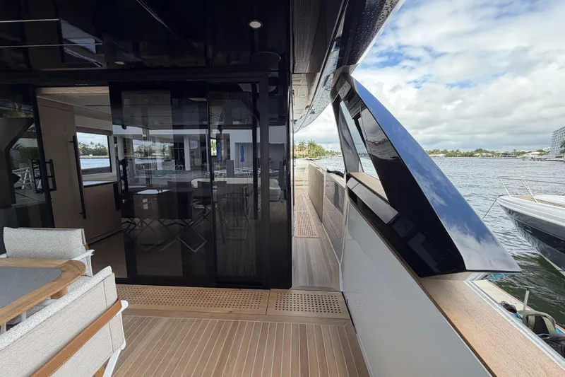 Slide: The Image of Luxurious deck of 2028 Solaris Power 70 Long Range yacht with modern design and waterfront view. - 9