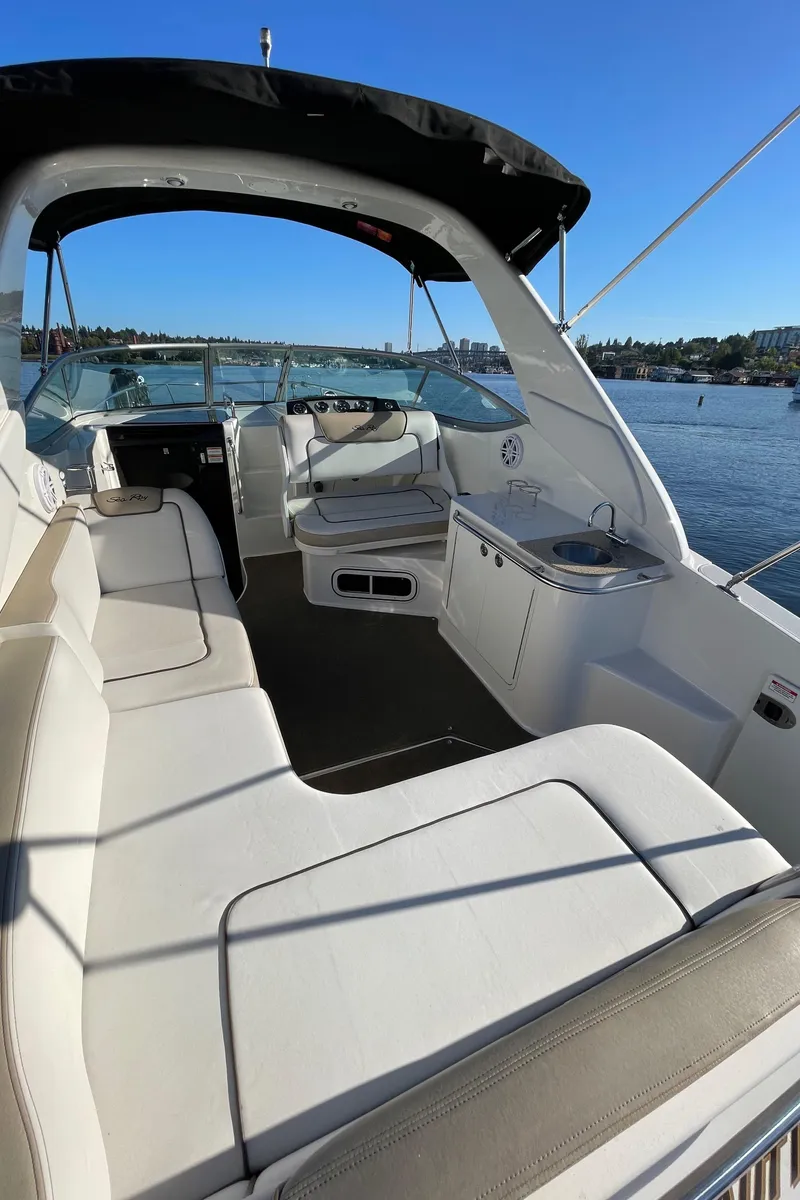 Slide: The Image of Interior of a 2015 Sea Ray Sundancer 280 yacht on calm waters. - 10