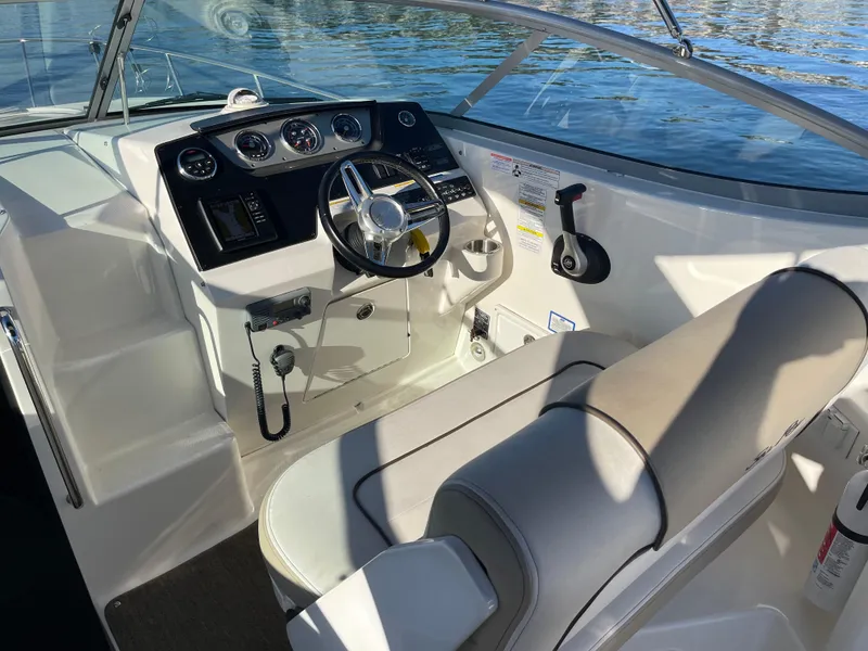Slide: The Image of Interior of a 2015 Sea Ray Sundancer 280 with helm console. - 13