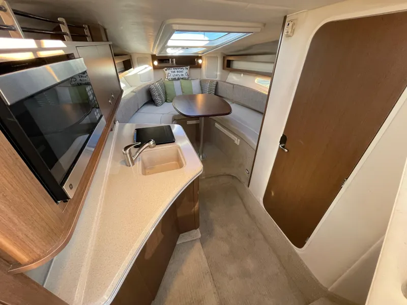 Slide: The Image of Interior of 2015 Sea Ray Sundancer 280 yacht with modern amenities. - 14