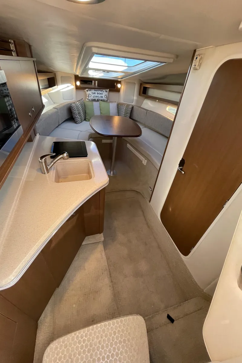 Slide: The Image of Interior of 2015 Sea Ray Sundancer 280 yacht with cozy seating area. - 15