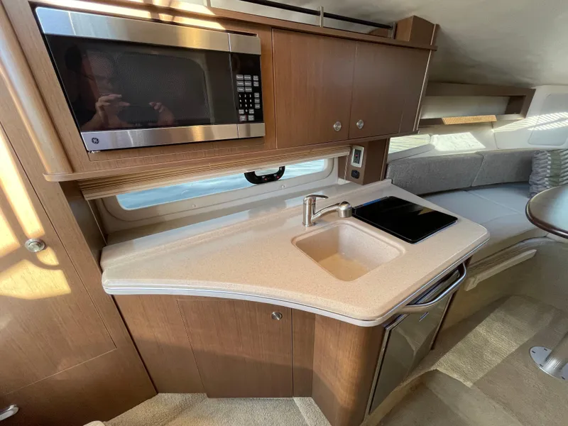 Slide: The Image of Interior of 2015 Sea Ray Sundancer 280 yacht kitchen. - 19