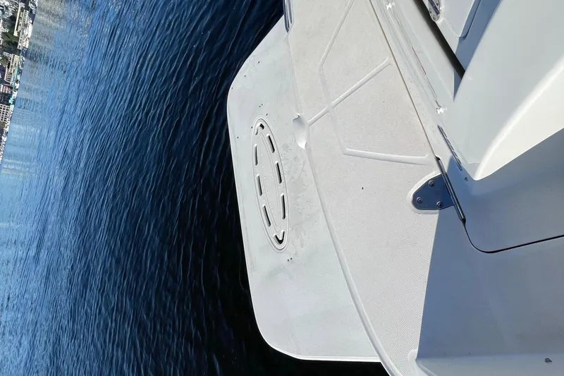 Slide: The Image of Rear view of a 2015 Sea Ray Sundancer 280 on calm water. - 30