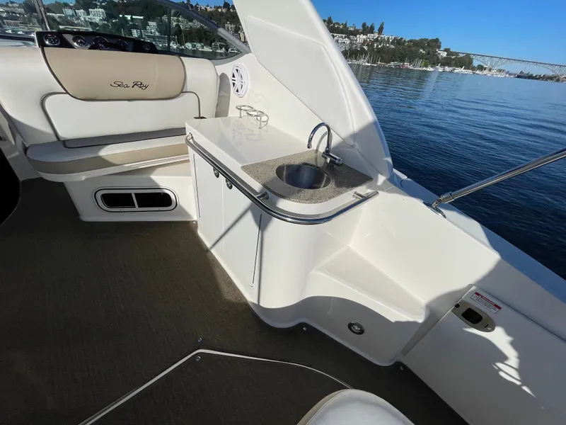 Slide: The Image of Interior of a 2015 Sea Ray Sundancer 280 yacht with sink and seating area. - 7