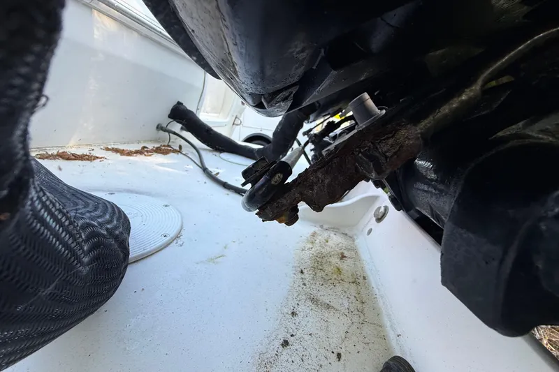 Slide: The Image of Close-up of the engine area in a 2000 Sport-Craft 241 Walk Around boat. - 17