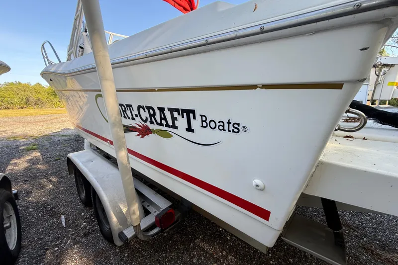 Slide: The Image of 2000 Sport-Craft 241 Walk Around boat on trailer, side view. - 20