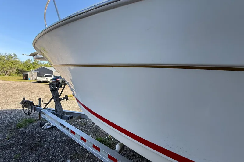 Slide: The Image of 2000 Sport-Craft 241 Walk Around boat on trailer, side view. - 26