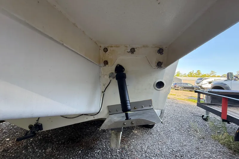 Slide: The Image of Rear view of a 2000 Sport-Craft 241 Walk Around boat, showing trim tab and hydraulic system. - 31