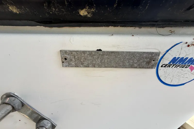 Slide: The Image of 2000 Sport-Craft 241 Walk Around boat with NMAA certified sticker and metal plate. - 37